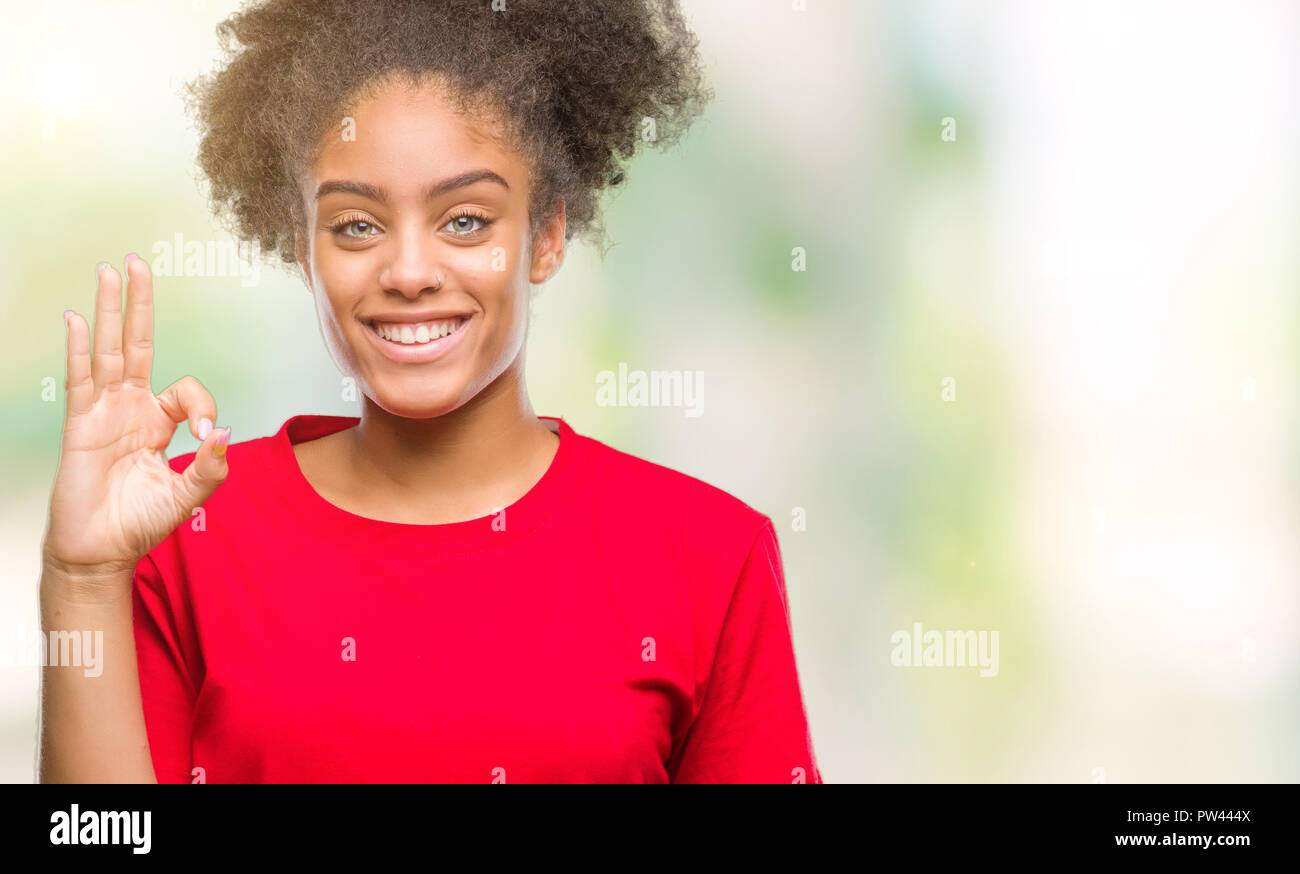 Young afro american woman over isolated background smiling positive ...