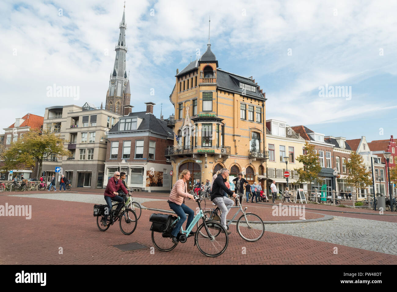 Leeuwarden - cyclists passing Centraal Apotheek - an art nouveau building in Leeuwarden, Friesland, Netherlands, Europe Stock Photo