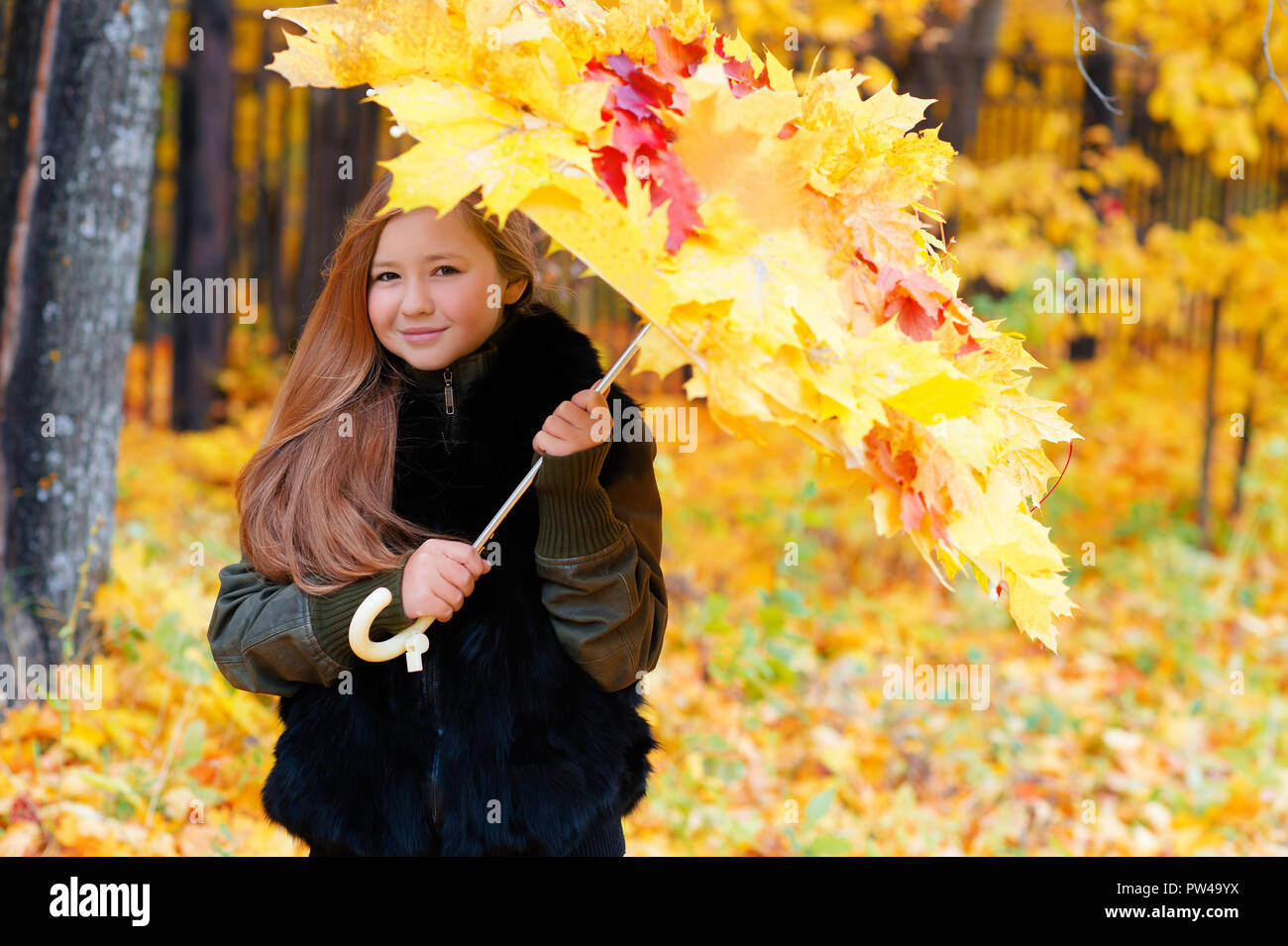 charming girl with umbrella autumn leaves Stock Photo - Alamy