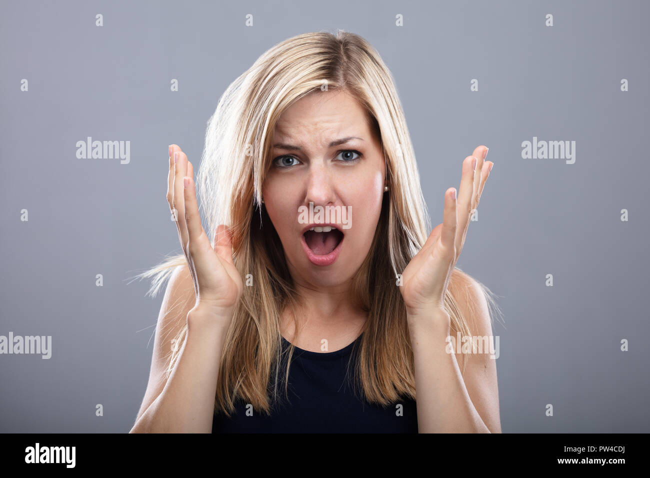 Photo Of Shouting Young Woman On Grey Background Stock Photo