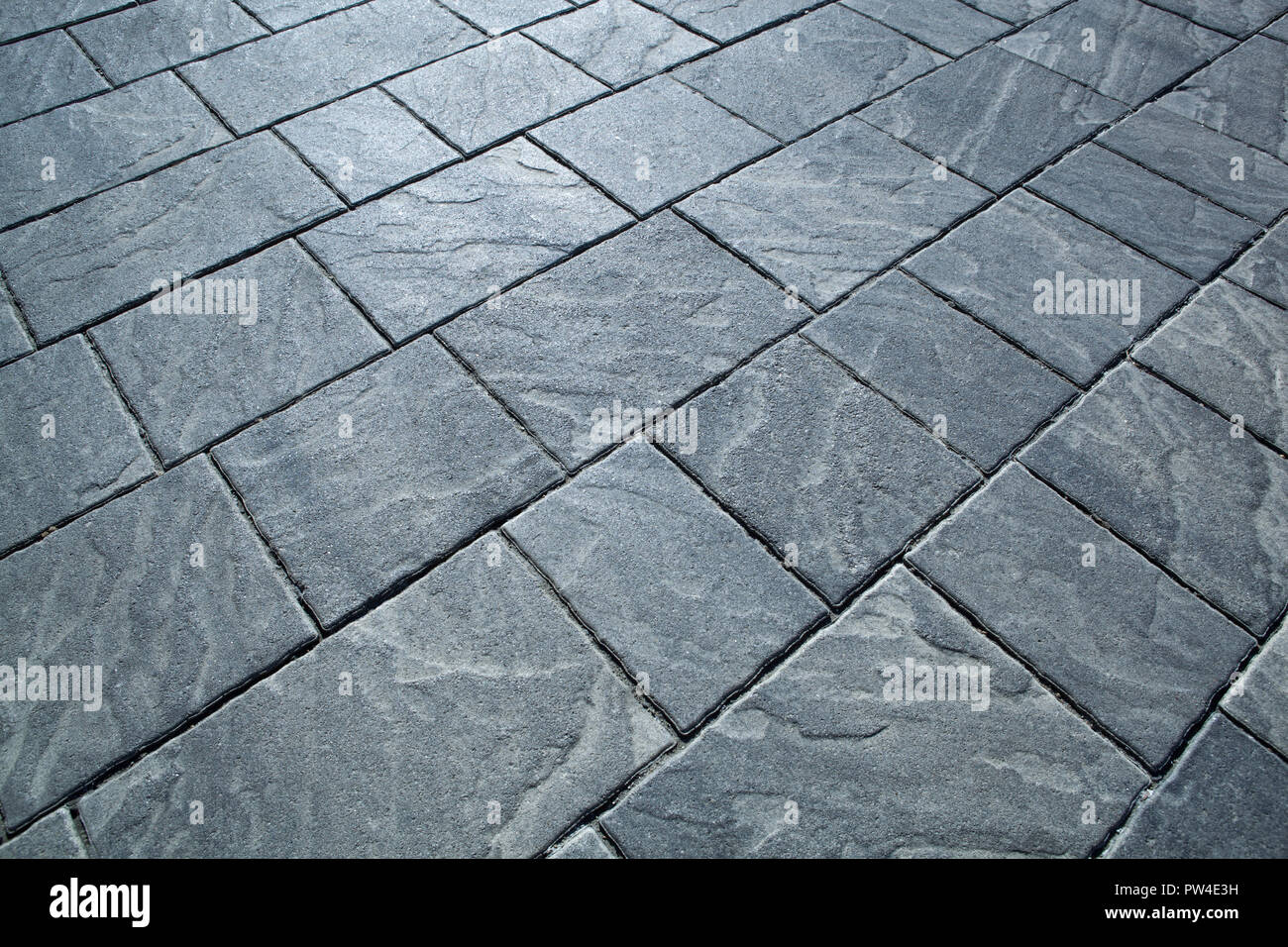 city rectangular gray paving tiles close up Stock Photo
