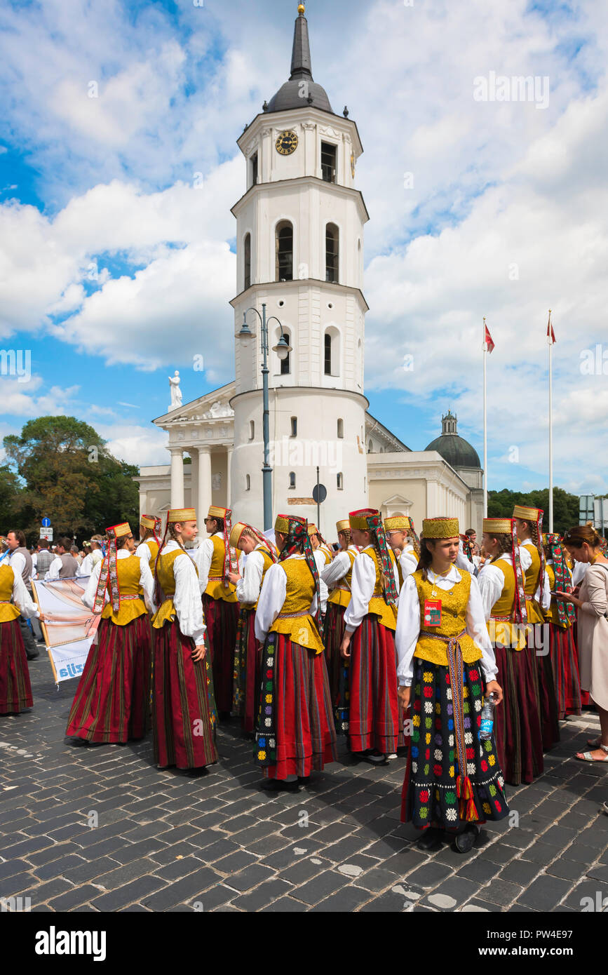 Lithuania festival, view of young women in traditional costume waiting to parade through Cathedral Square in the Song and Dance Festival in Vilnius. Stock Photo