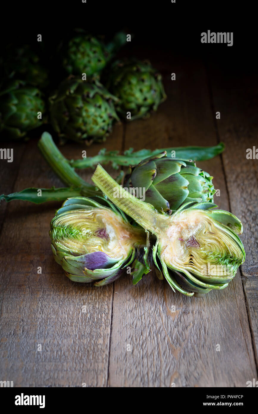Globe artichoke cut in half showing a cross section of inside Stock Photo Alamy