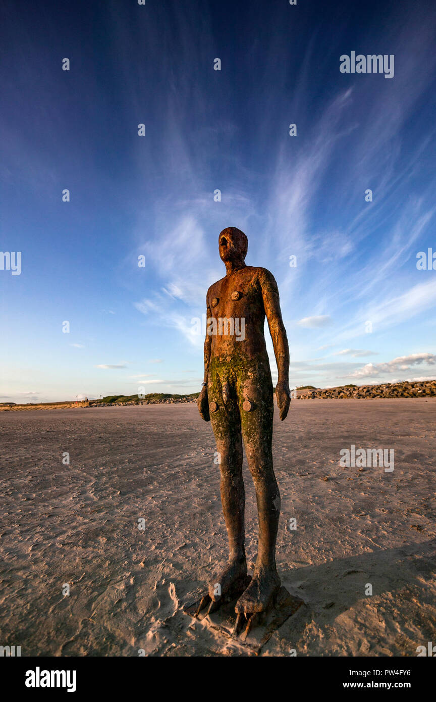 'Another Place' by Antony Gormley Iron Man statues on Crosby Beach Liverpool Merseyside Stock Photo