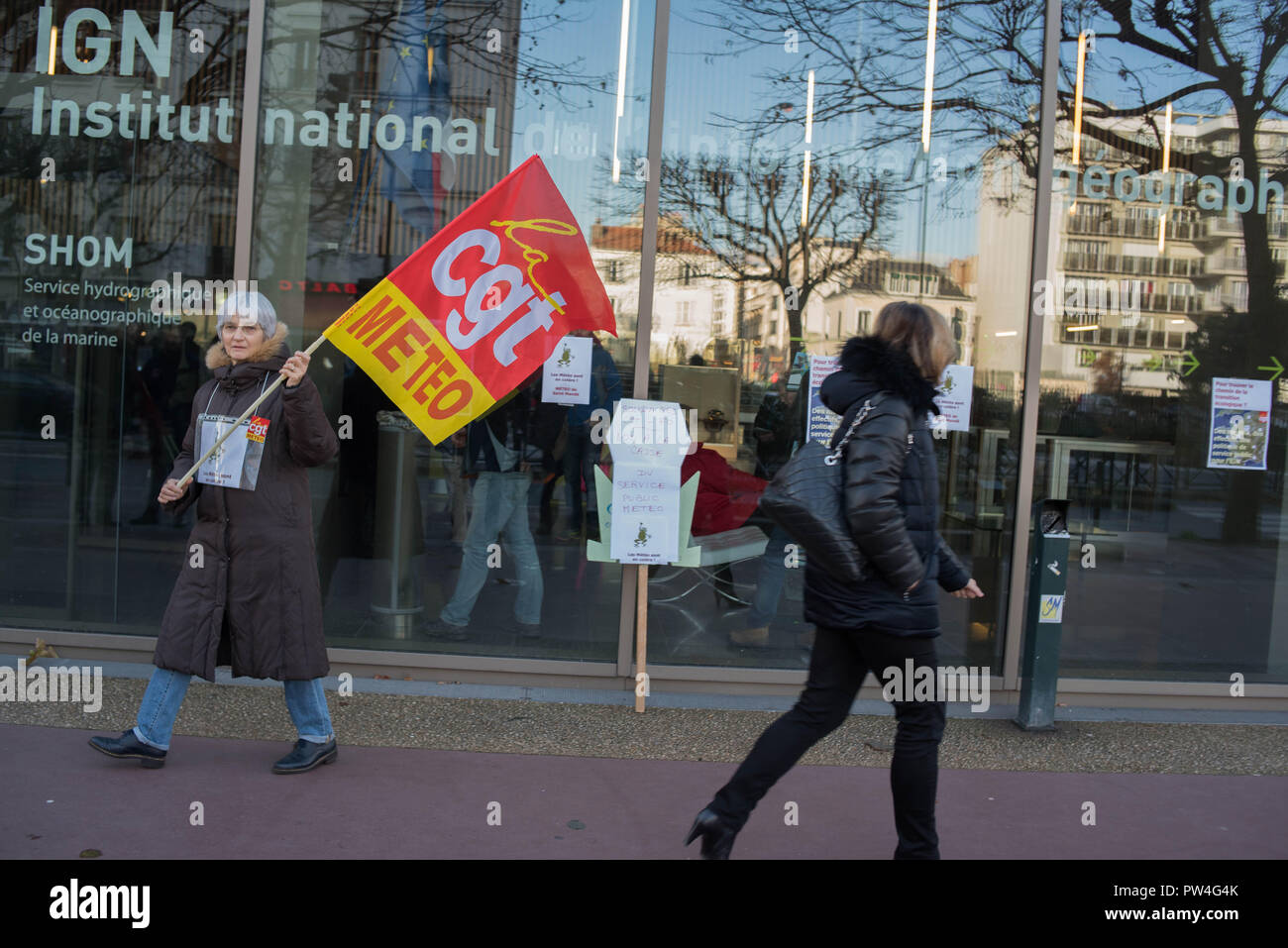 Demonstration against the deletions of posts at Météo France in front of the headquarters of Météo-France and the IGN. Stock Photo