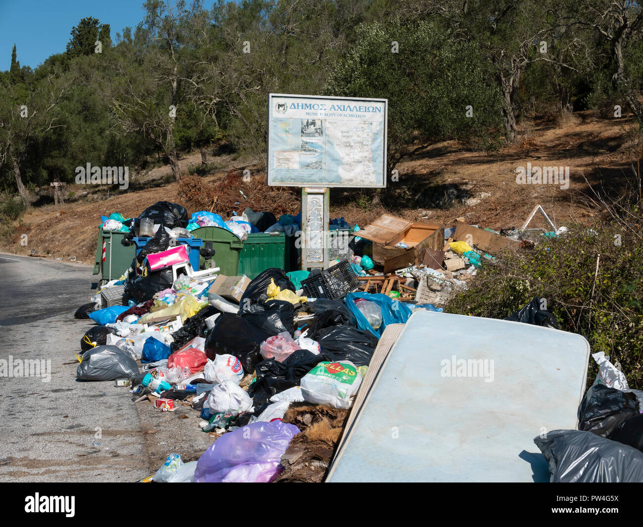 A pile of rotting, uncollected refuse, Achilleion, Corfu, Ionian Islands, Greece. Stock Photo
