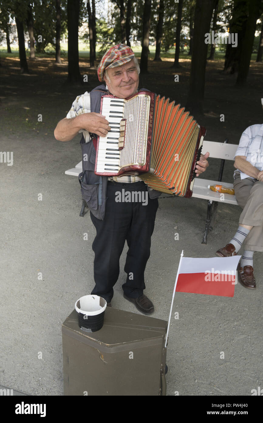 Old street musician in Warsaw Poland. Stock Photo