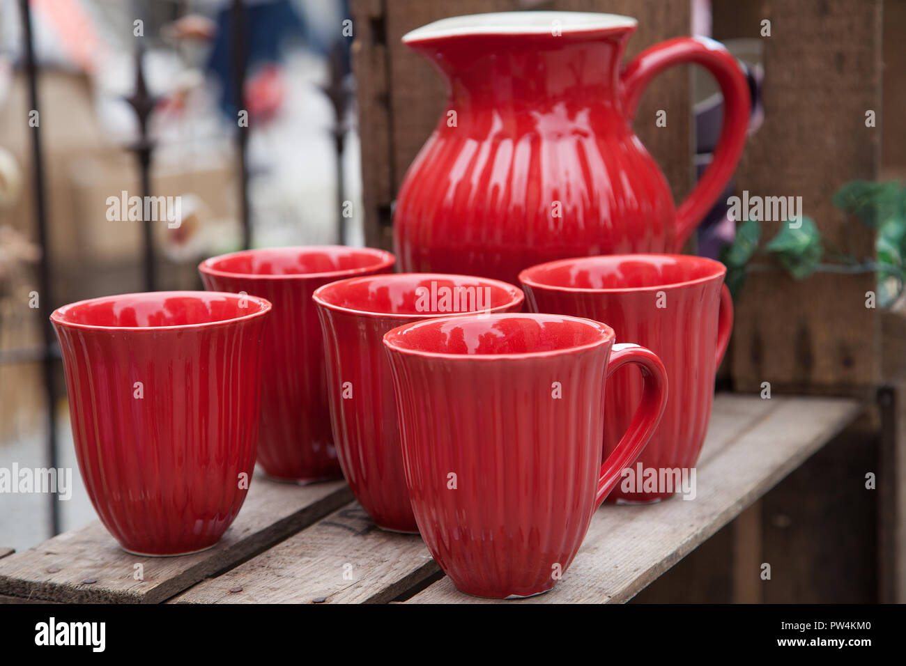 Red porcelain jug and mugs Stock Photo