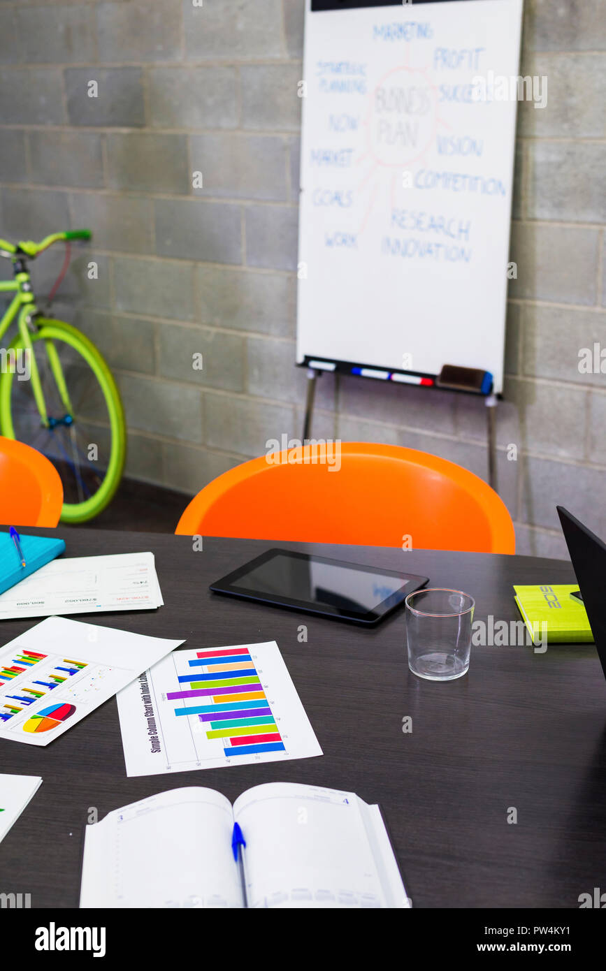 High angle view of office supplies on conference table in office Stock Photo