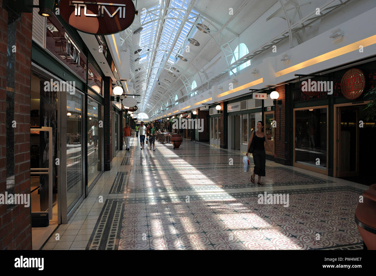 Elegant lady shopping at The Victoria Wharf Shopping Centre in Cape