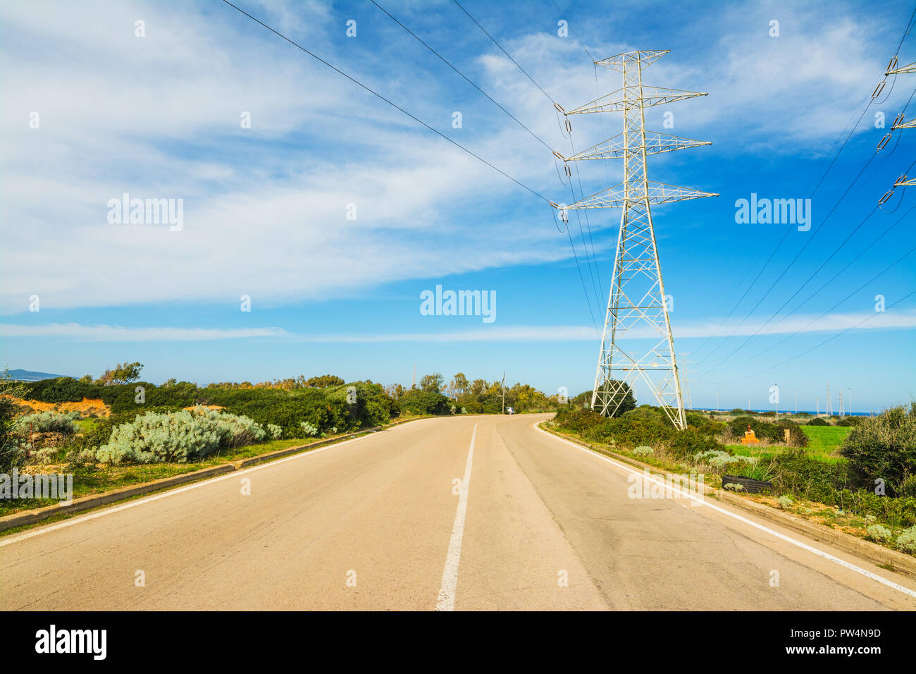 Power towers under a cloudy sky Stock Photo - Alamy