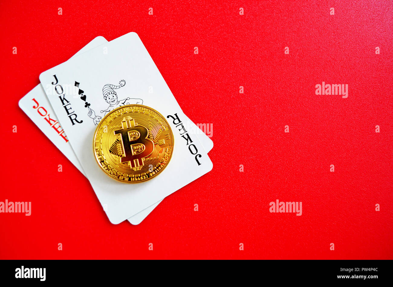 Bitcoin with joker playing cards Stock Photo