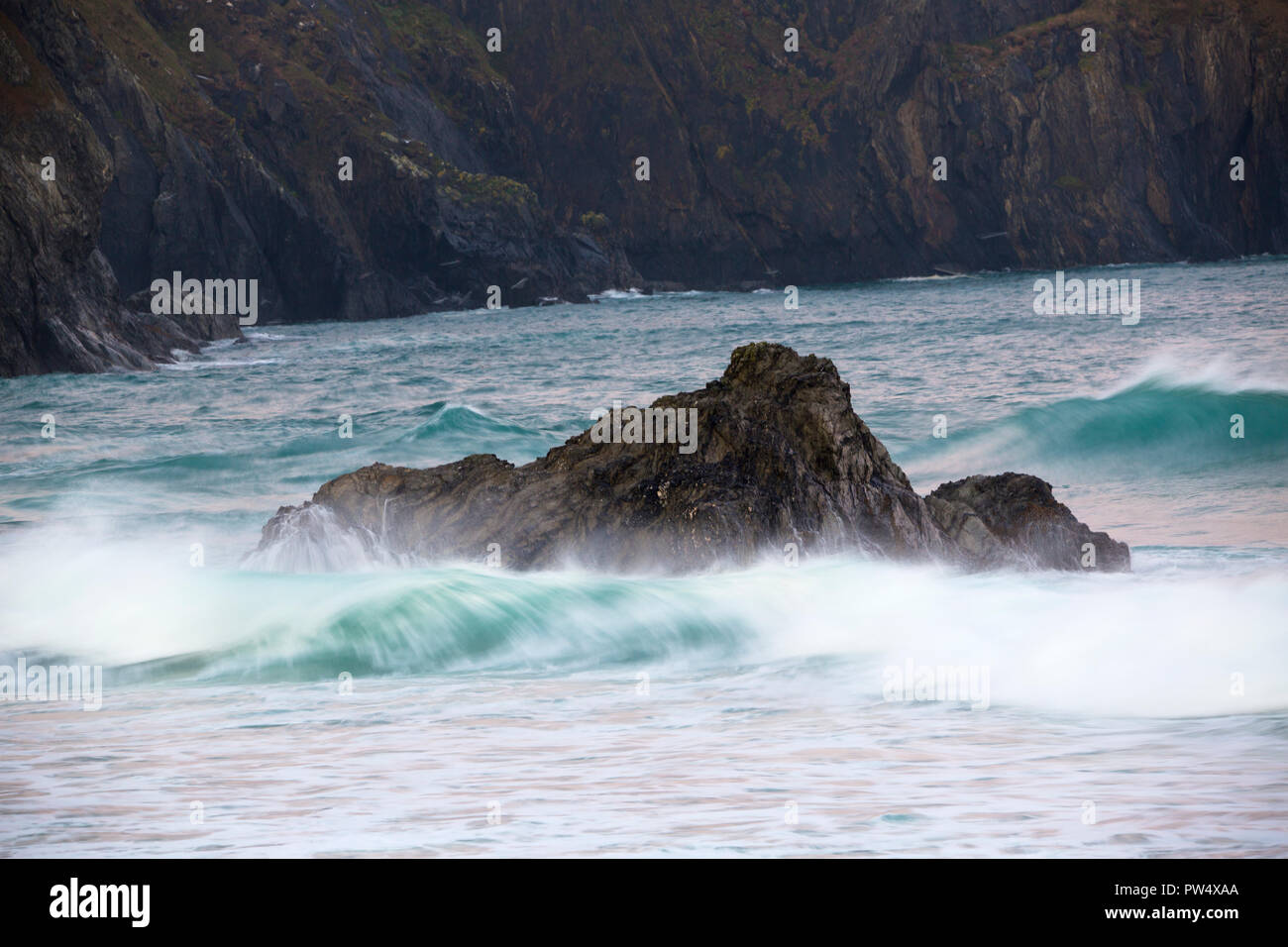 Waves crashing in on the rocky Cornish Coast at Holywell Bay in Cornwall Stock Photo