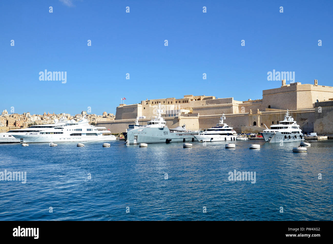 Luxury Yachts in the Grand Harbour at Birgu in the Maltese Three Cities. Stock Photo
