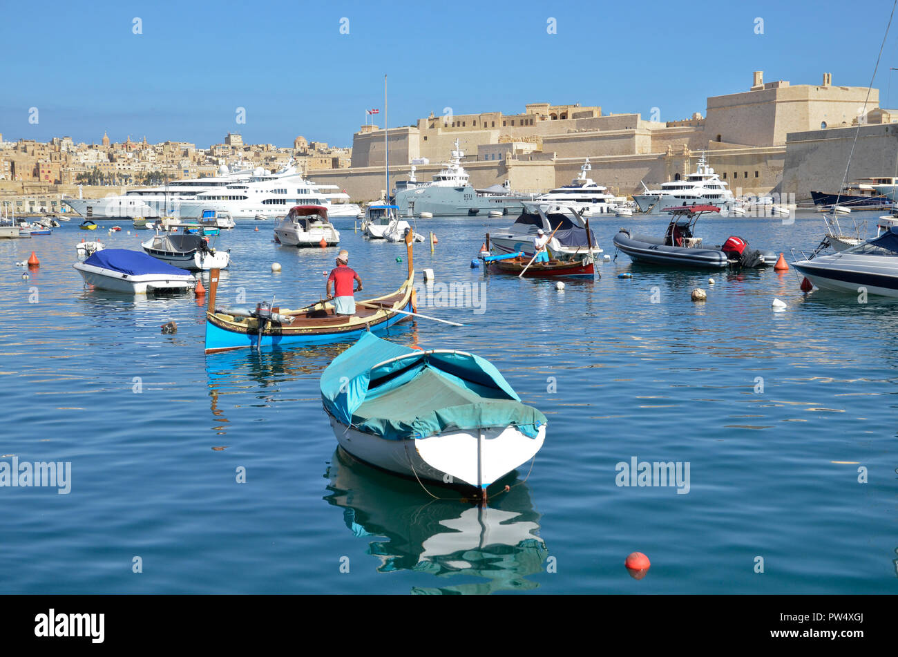 Boats on the Grand harbour in the Three Cities area of Malta Stock Photo
