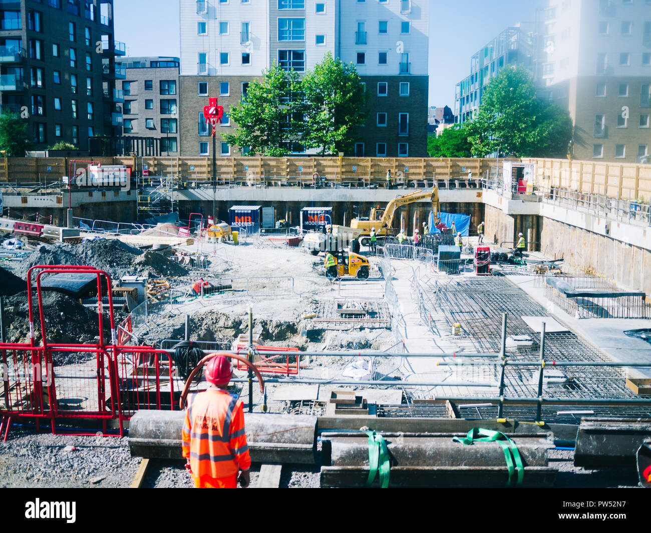 Worker glancing over a building site Stock Photo