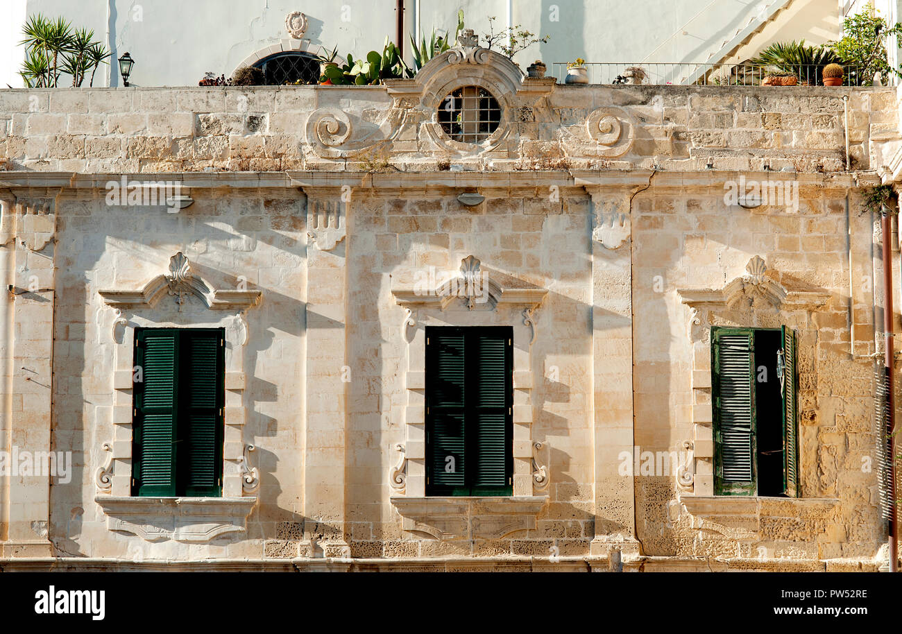 A baroque palazzo residence in the square of Piazza del Duomo in Lecce,  'the Florence of the South', a popular tourist destination in Puglia, Italy. Stock Photo