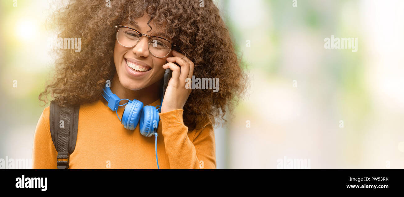 African american student woman happy talking using a smartphone mobile ...