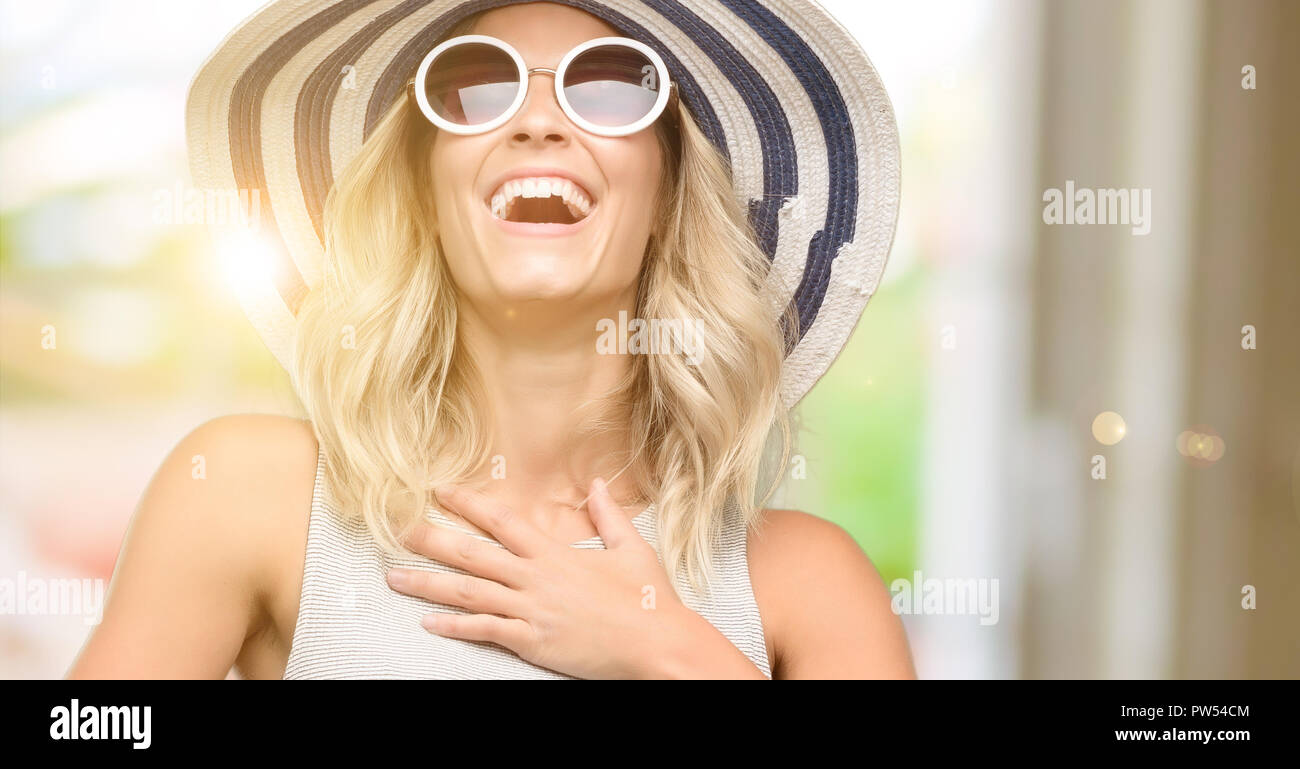 Wearing big hat sunglasses hi-res stock photography and images - Alamy