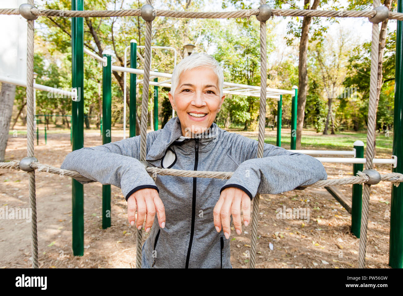 Portrait Of Healthy Happy Senior Woman At Outdoor Gym. Stock Photo