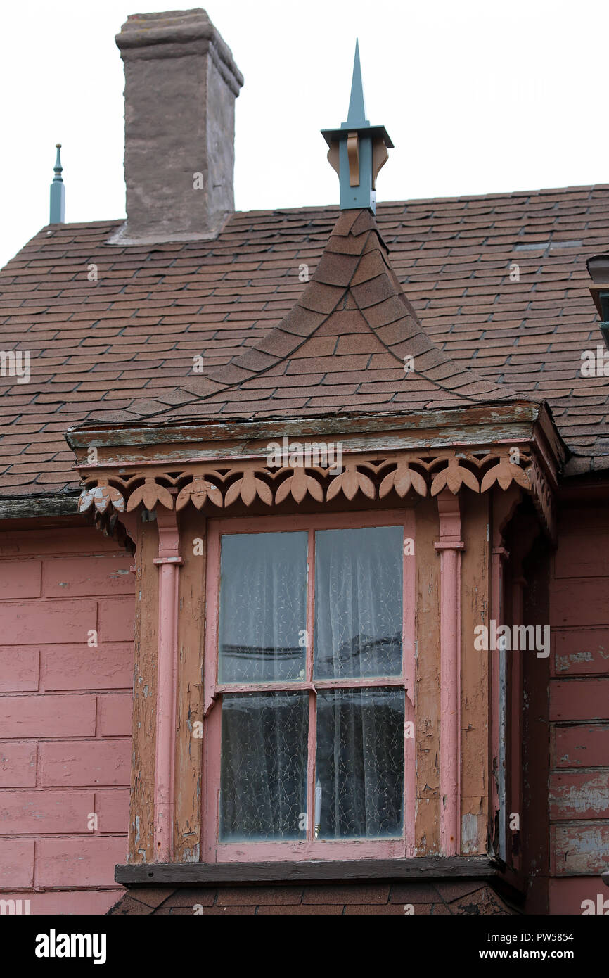 closeup of decorative Victorian window on historic house Stock Photo