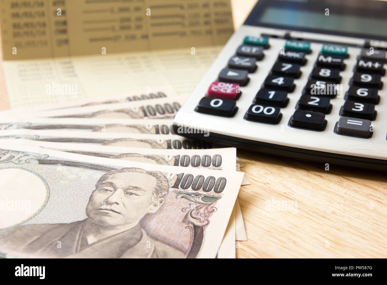 Saving account passbok, japanese yen, calculator Stock Photo Alamy
