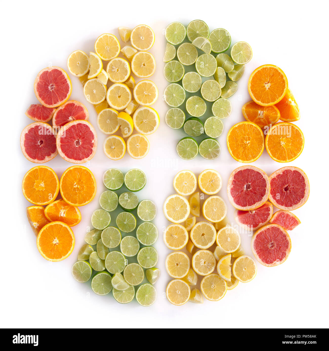Many fruits in the shape of a sliced citrus including oranges, grapefruits, lemons and limes Stock Photo