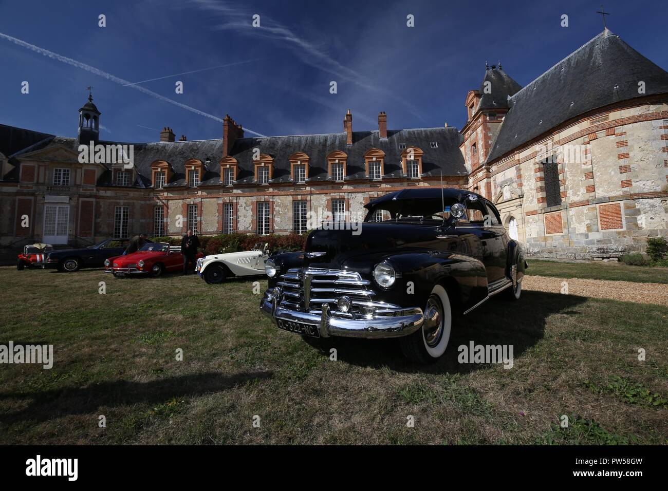 Chevrolet Stylemaster, Morgan Plus 8, Karmann Ghia, Rolls Royle, and a Beach Buggy at Château de Neuville in Gambais (78) – France. Stock Photo