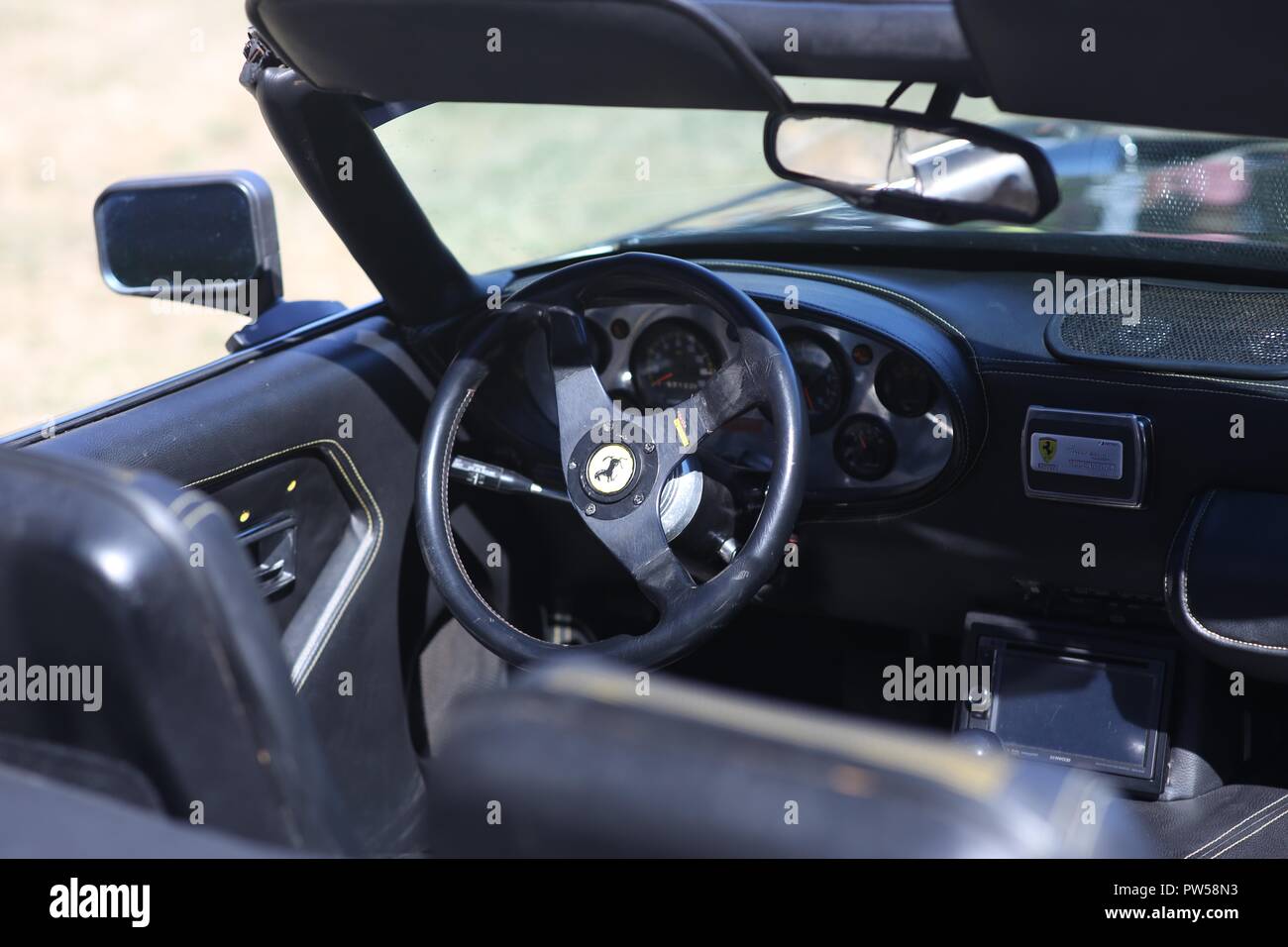 In the Cockpit a of a Ferrari at Château de Neuville in Gambais (78) – France. Stock Photo