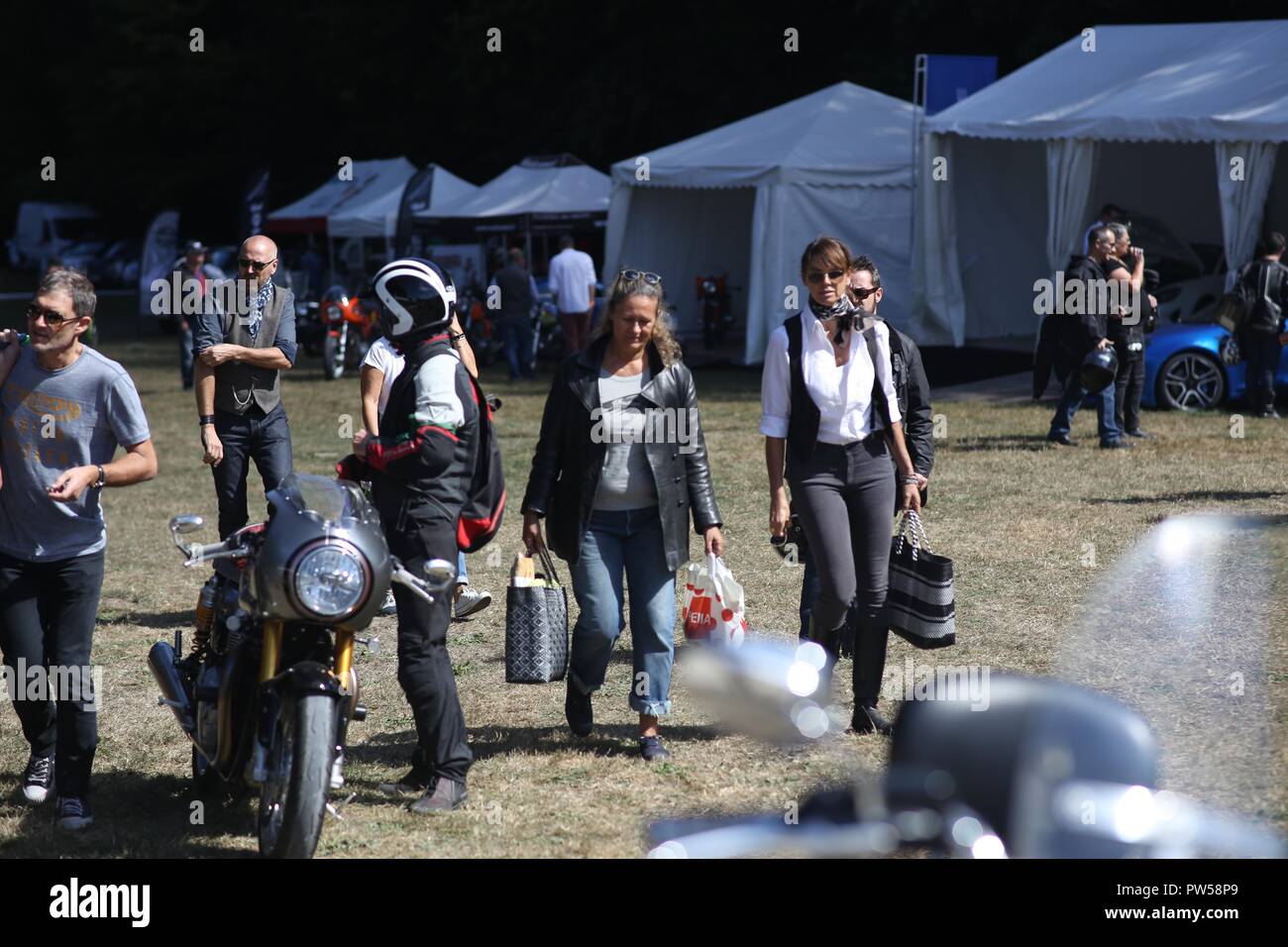 Female Bikers arriving at Château de Neuville in Gambais (78) – France. Stock Photo