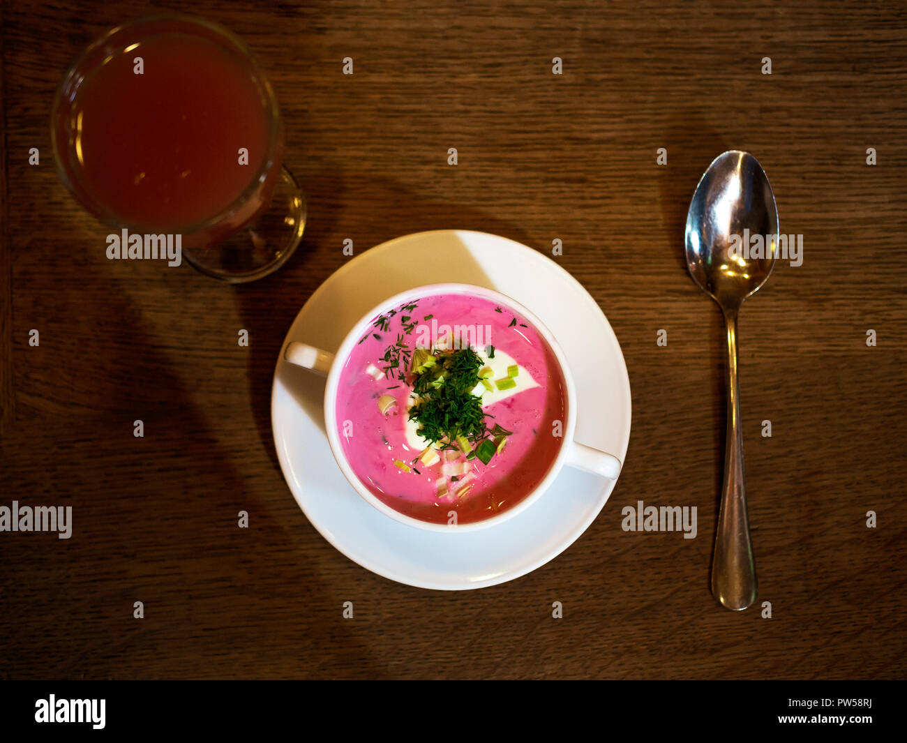 Saltibarsciai, or Lithuanian cold borscht, blended with sour cream (yogurt), and sprinkled with chives Stock Photo