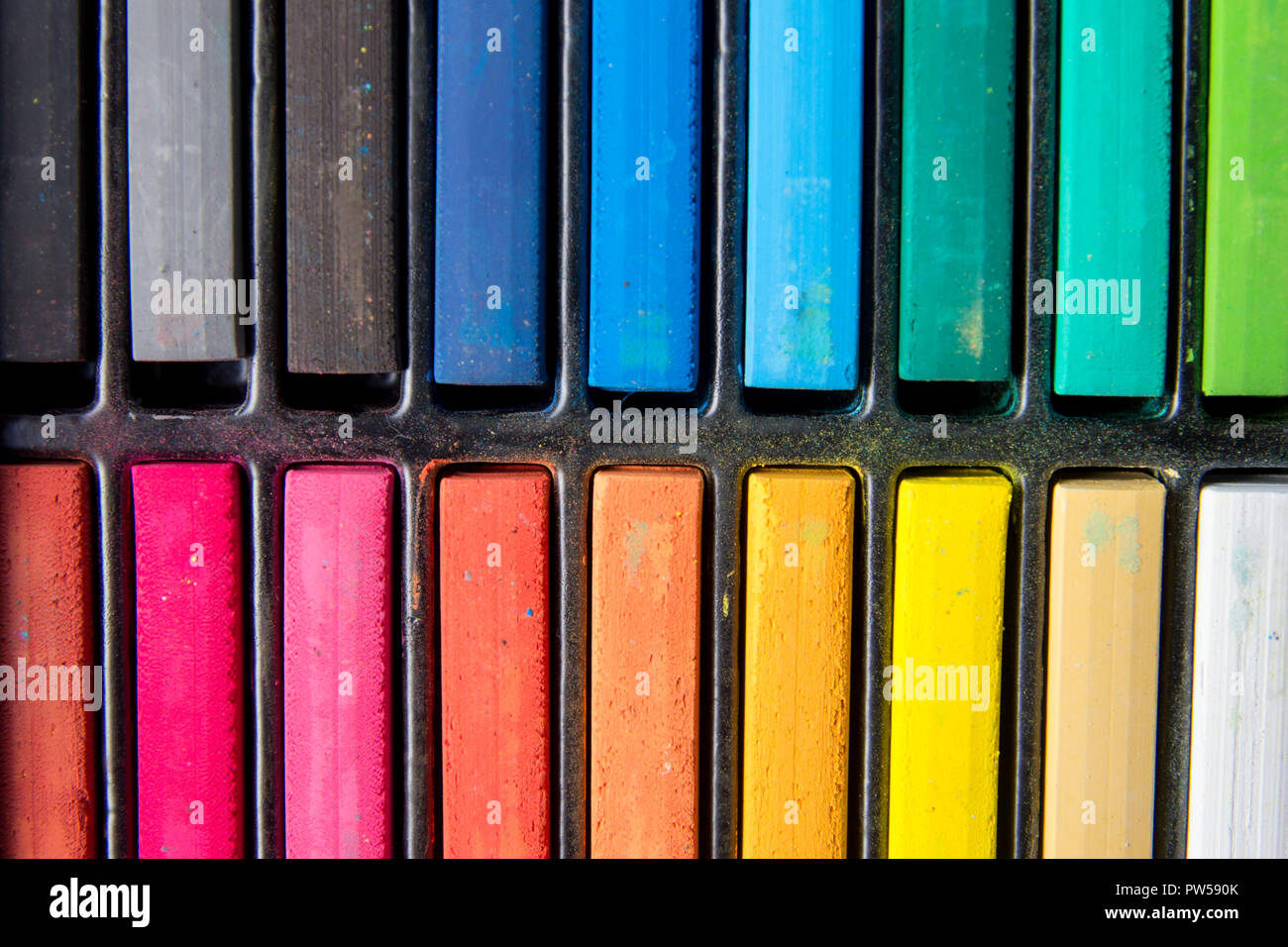 Set of colorful chalk stick on black tray Stock Photo Alamy