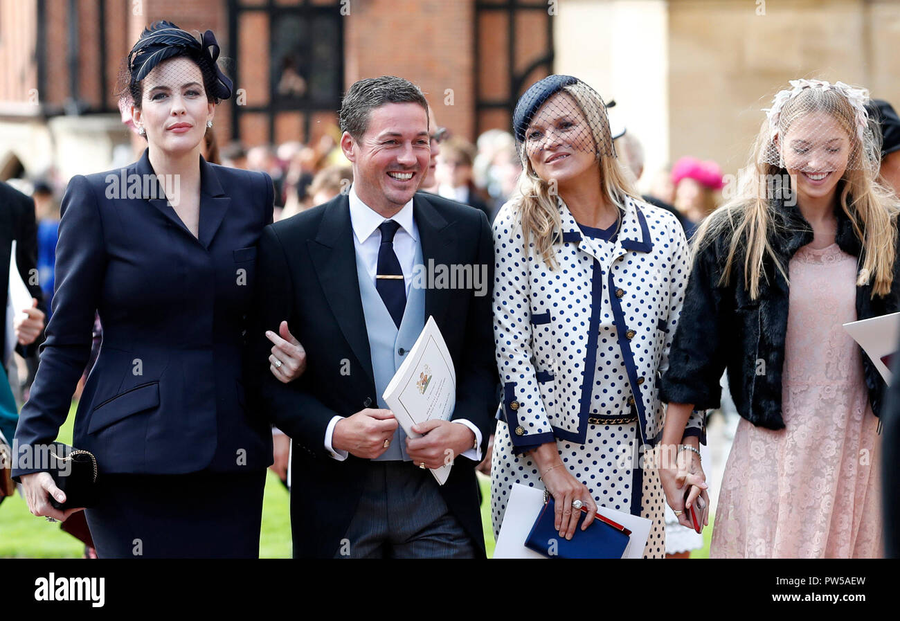 (left to right) US actress Liv Tyler, her husband Dave Gardner, Kate Moss and her daughter Lila attend the wedding of Princess Eugenie of York and Jack Brooksbank in St George's Chapel, Windsor Castle. Stock Photo
