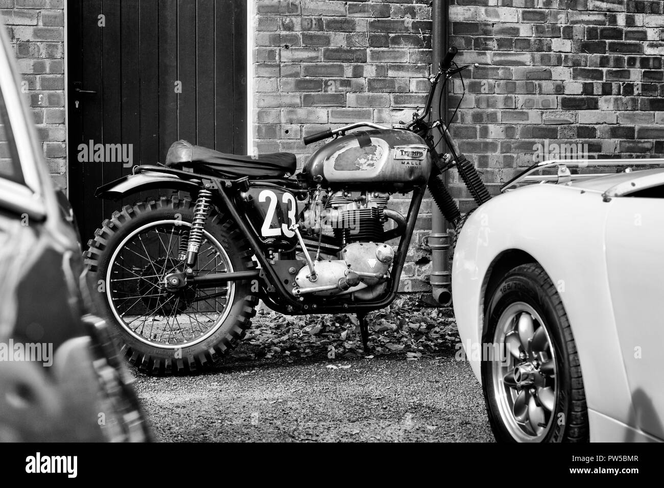 Triumph motorcycle at the Autumn sunday scramble event at Bicester Heritage Centre. Oxfordshire, England. Black and white Stock Photo