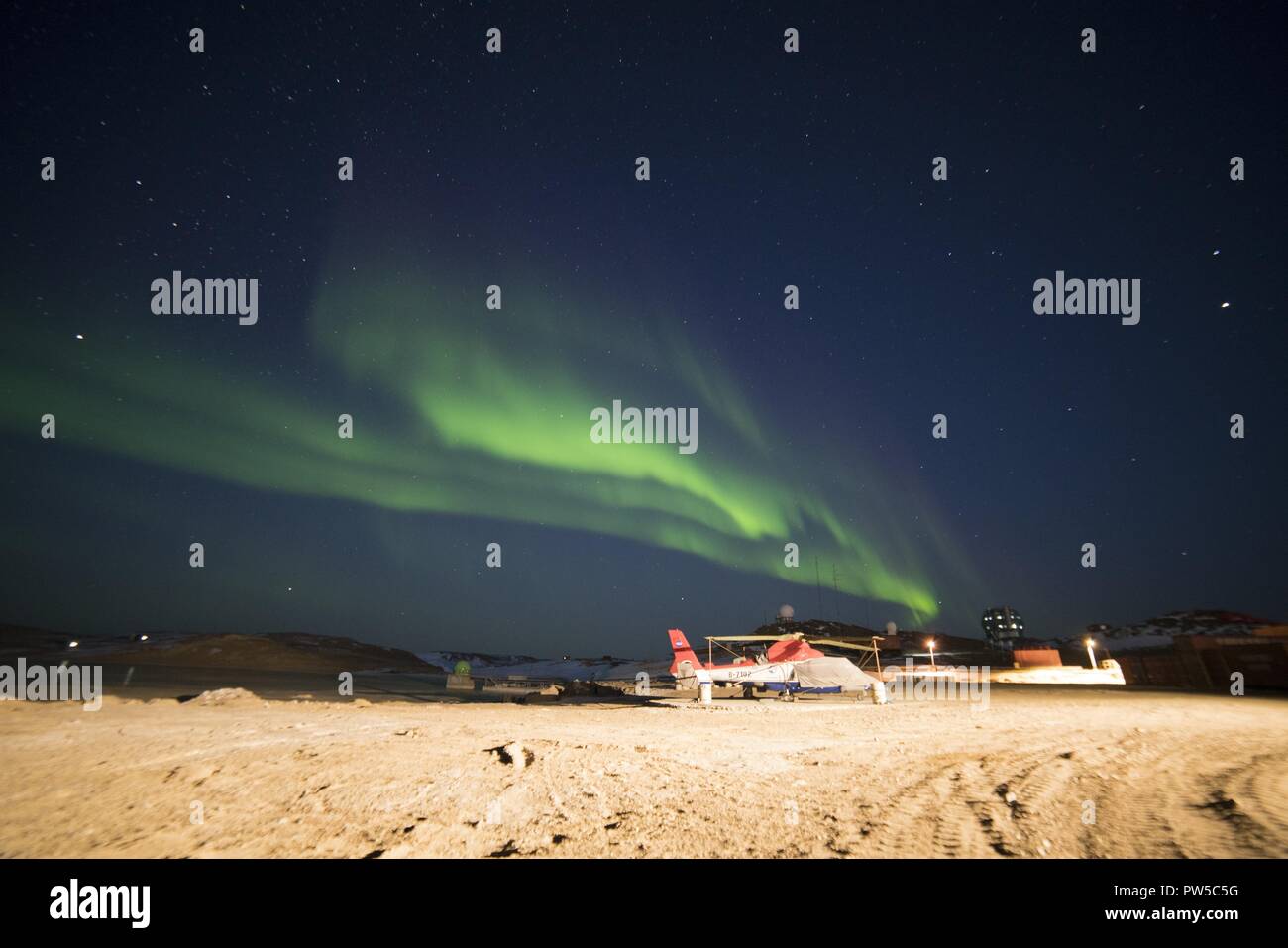 Bright colorful northern lights in the night sky. Antarctica Stock