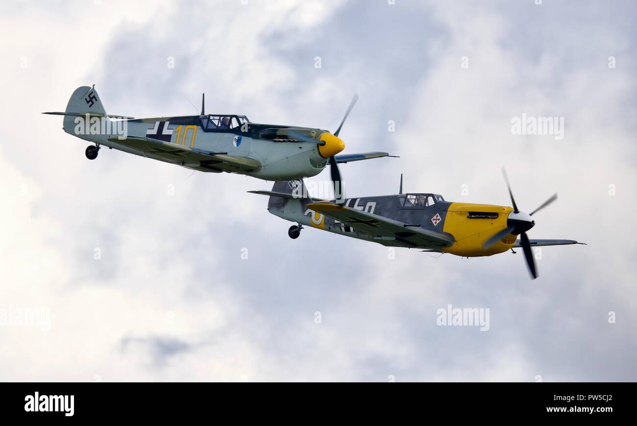 Pair of Hispano HA-1112 M4L Buchons (Messerschmitt Bf 109) flying at the IWM Duxford Battle of Britain Airshow on the 23 September 2018 Stock Photo