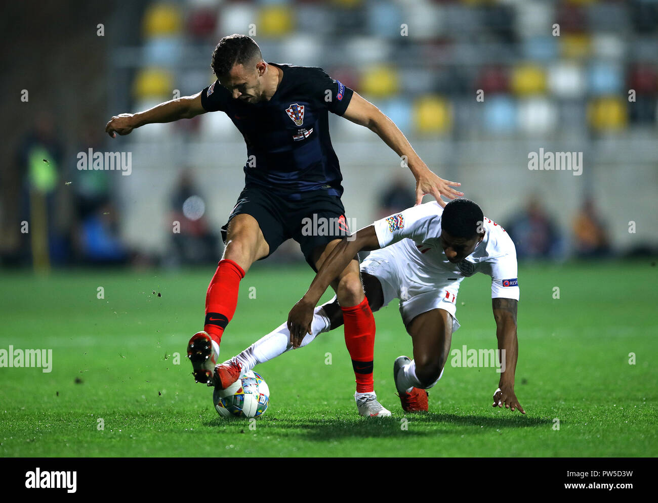 Croatia's Ivan Perisic (left) and England's Marcus Rashford (right) battle for the ball during the UEFA Nations League match at Stadion HNK Rijeka in Croatia. Stock Photo