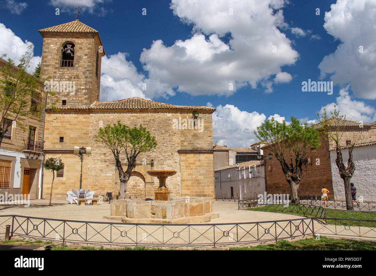 Courtyard in front of the Church of San Pedro (Iglesia de San Pedro) with a water fountain in the center, Ubeda, Spain Stock Photo