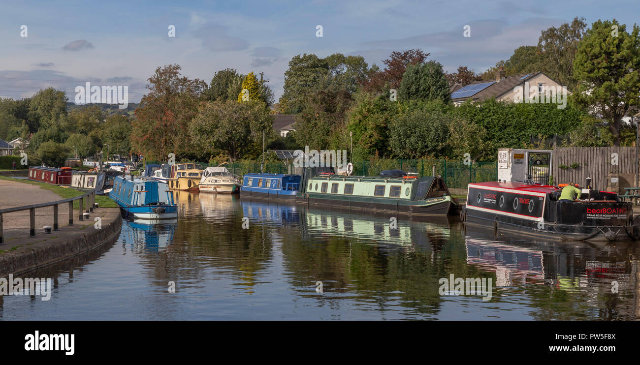 Barges on the Leeds Liverpool Canal at the top of the Five Rise Locks at Bingley, West Yorkshire. Stock Photo