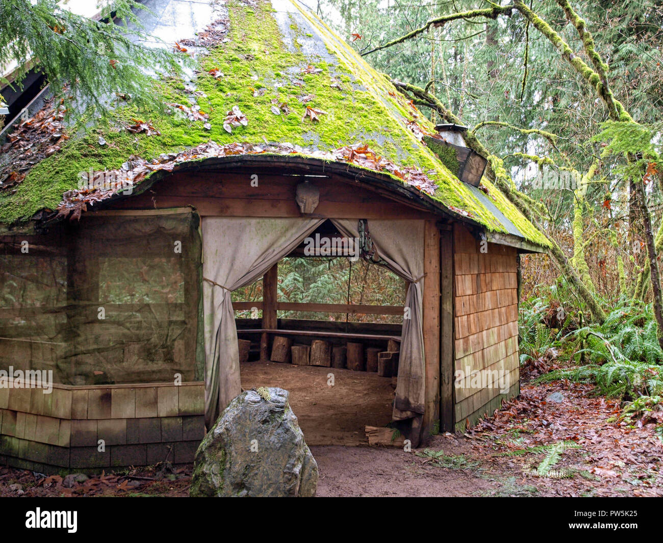 A beautiful little rustic hobbit house in a park in Washington state, USA Stock Photo