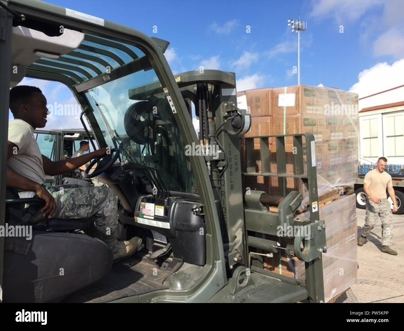 Airman 1st Class Dakwon Aktkinson, 502nd Logistics Readiness Squadron forklift operator, moves cargo around the air operations terminal Sept. 22, 2017 at Joint Base San Antonio-Kelly Field.  The cargo was being staged at the Federal Emergency Management Agency’s Incident Support Base at Kelly for transport to areas devastated by Hurricane Maria Stock Photo