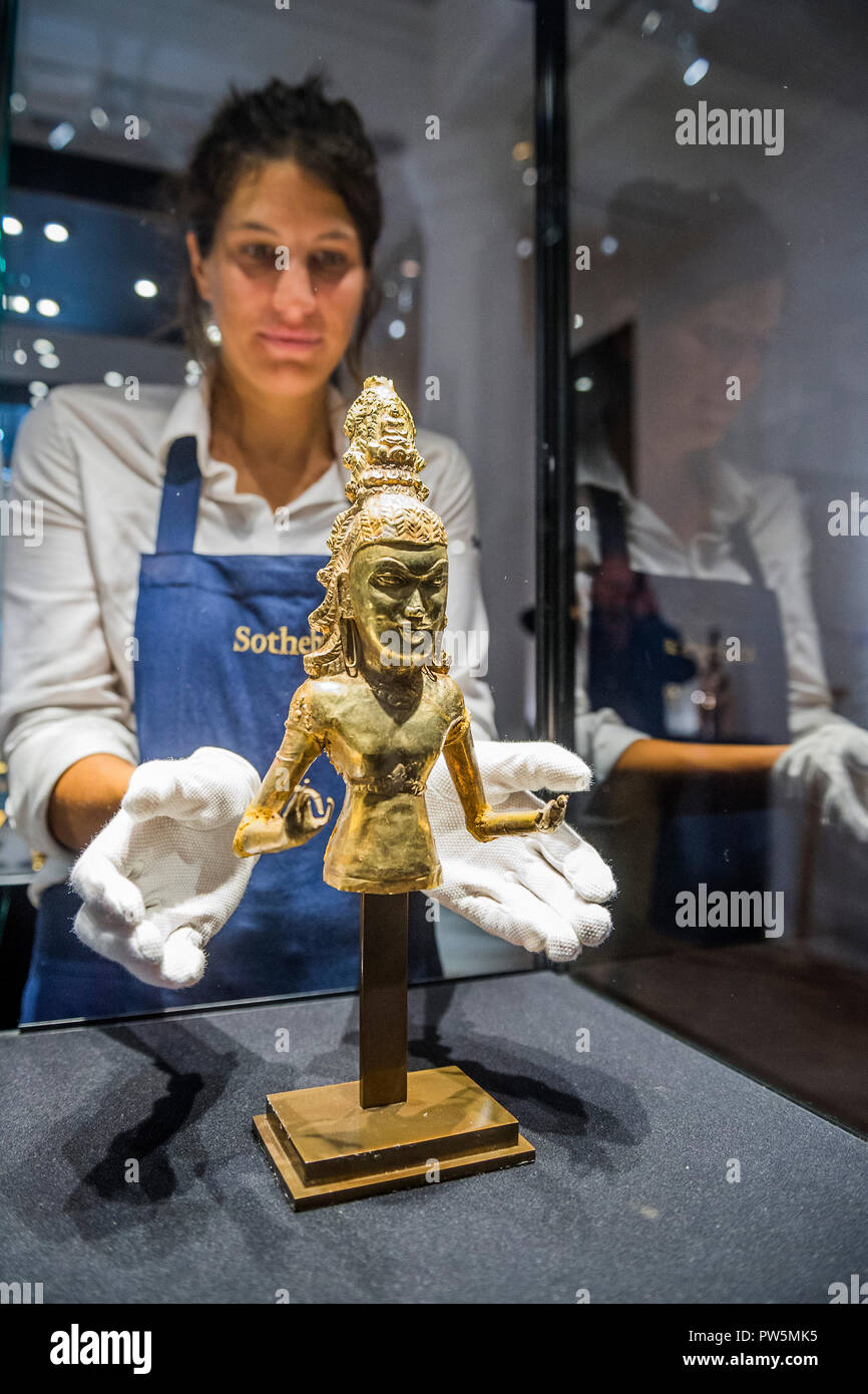 London, UK. 12th Oct 2018. Late 7th / Early 8th Century Gold Figure of the Bodhisattva Avalokiteshvara (Lot 26) Estimate: £80,000 – 100,000 - The Midas Touch, a preview of a forthcoming sale dedicated entirely to Gold, at Sotheby’s New Bond Street, London.. Credit: Guy Bell/Alamy Live News Stock Photo