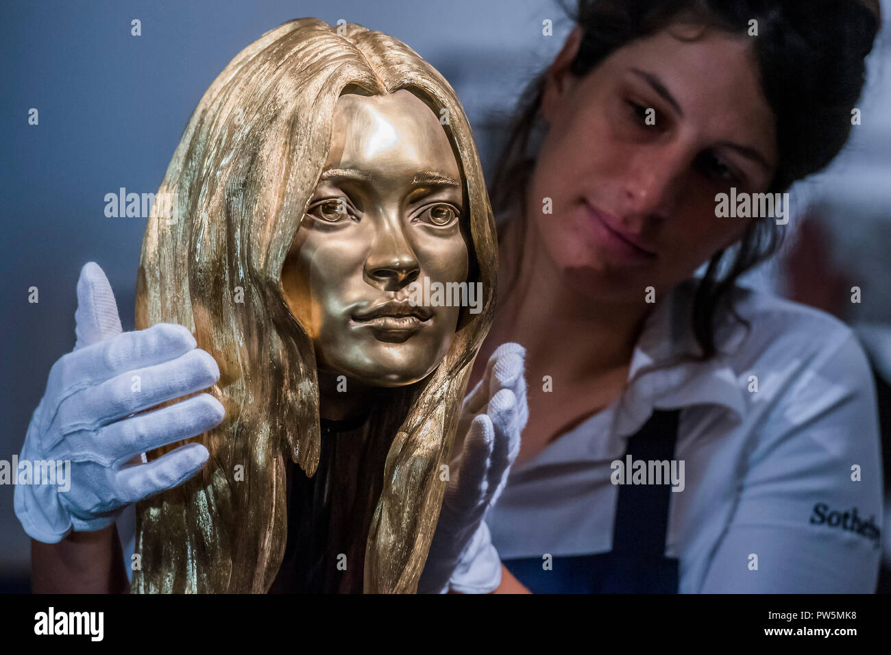 London, UK. 12th Oct 2018. A bust of Kate Moss in solid 18-carat gold by Marc Quinn, est £300-400,000 - The Midas Touch, a preview of a forthcoming sale dedicated entirely to Gold, at Sotheby’s New Bond Street, London.. Credit: Guy Bell/Alamy Live News Stock Photo