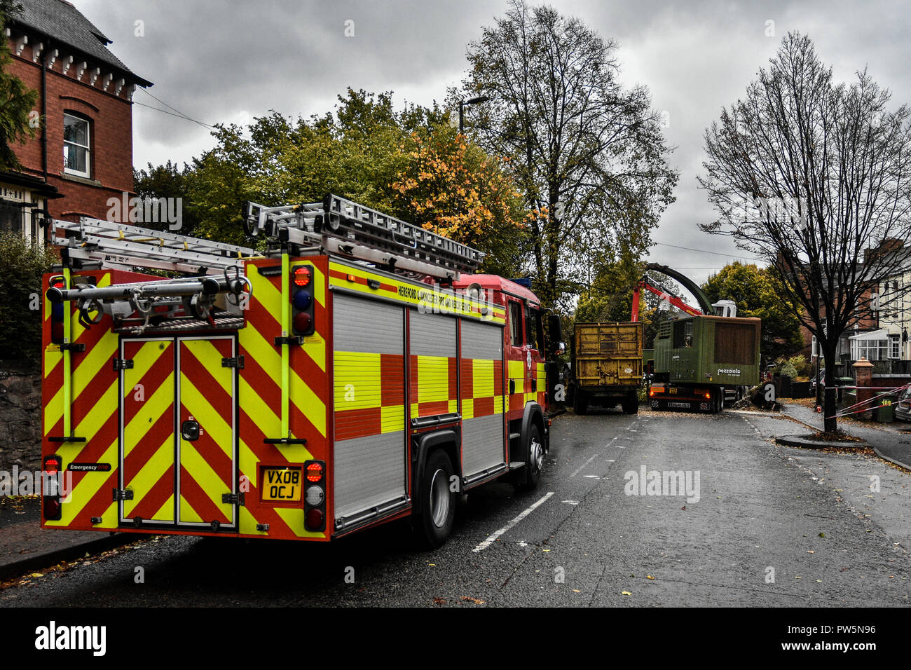 Leominster. 12th Oct 2018. UK Weather:A tree is cleared from the A49 Bargates Road in Leominster which had fallen across the road onto a car at lunchtime, the driver was  unhurt. Storm Callum has caused severe disruption in North Herefordshire closing the A49 between Leominster and Ludlow on Friday 12th October 2018. Credit: Jim Wood/Alamy Live News Stock Photo