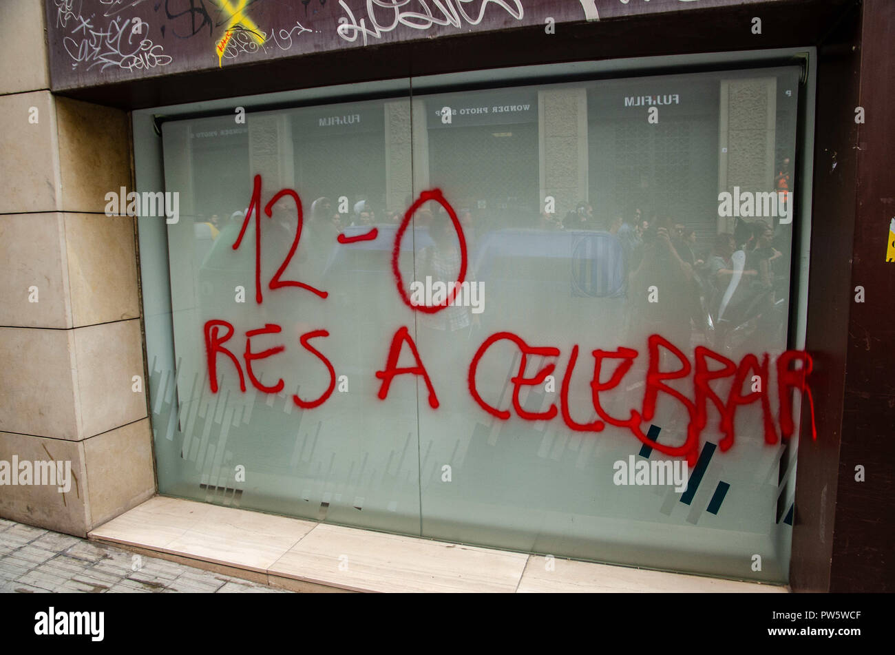 Barcelona, Catalonia, Spain. 12th Oct, 2018. The graffiti Nothing to celebrate is seen during the protest.Hundreds of people have demonstrated in the centre of Barcelona Under the motto antifascism which was everyone's thing. Credit: Paco Freire/SOPA Images/ZUMA Wire/Alamy Live News Stock Photo