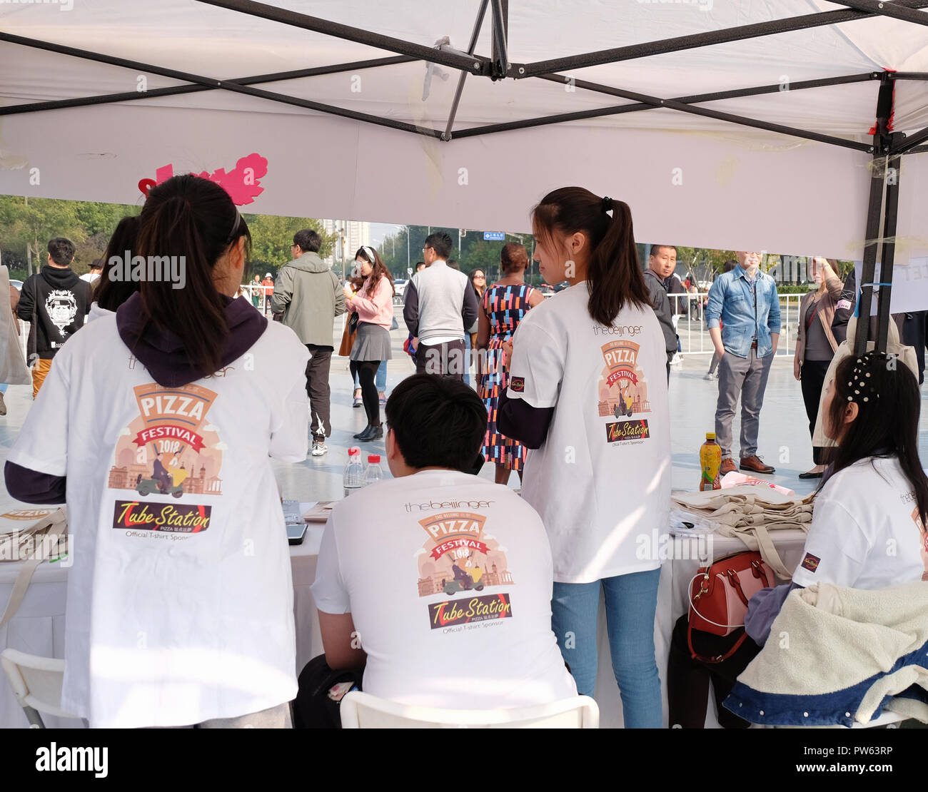 Beijing, China - October 13,2018: Expats and locals enjoying 2018 Beijing Pizza Festival at the Zhongguancun Software Park, Beijing, China. Fifth annual Beijing Pizza Festival on Oct 13-14 festival organized by The Beijinger - free monthly listings and entertainment website and magazine produced by True Run Media in Beijing, China. Stock Photo