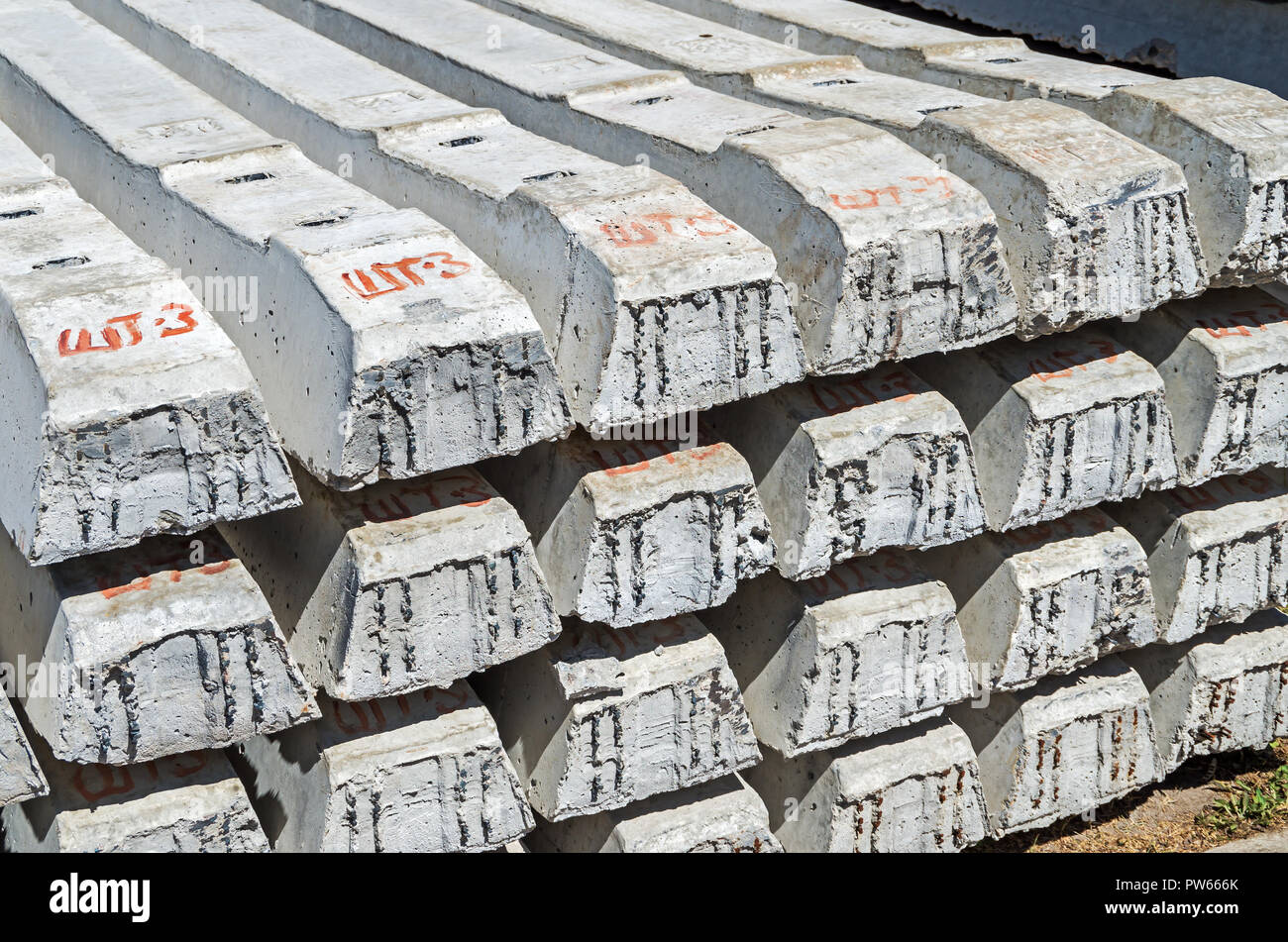 Set of new reinforced concrete sleepers are stacked on each other and