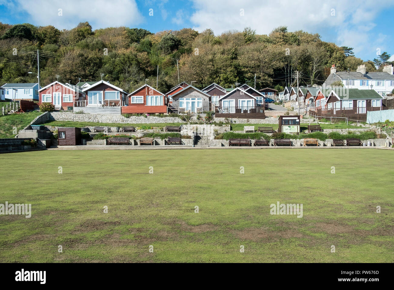 Holiday chalets overlooking Lyme Regis Bowling Club green in the coastal town of Lyme Regis in Dorset. Stock Photo