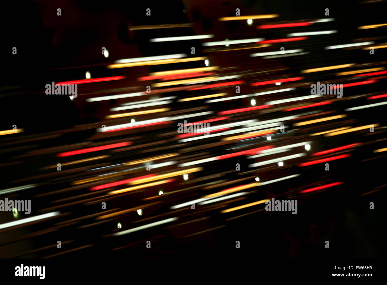 Colored blurred lines of light on dark background Stock Photo