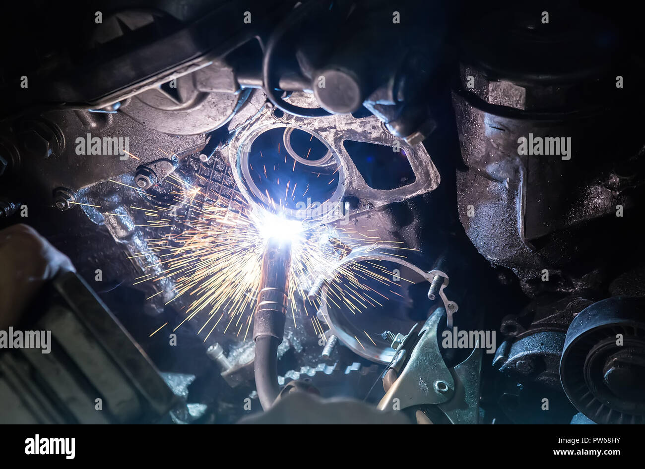 Welding work on car engine closeup Stock Photo Alamy